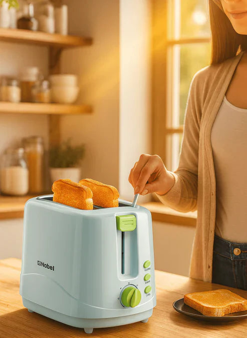 Nobel Toaster Breakfast Made Simple in white with two slots, featuring control buttons and a crumb tray for easy toasting.